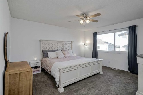 212 Cove Court, Chestermere, AB - Indoor Photo Showing Bedroom