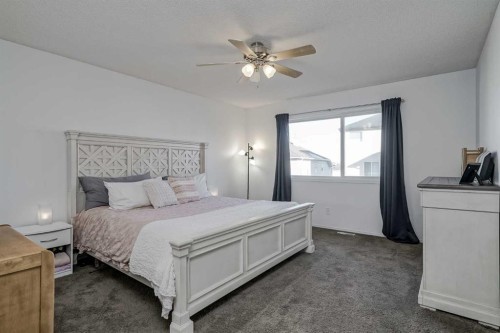 212 Cove Court, Chestermere, AB - Indoor Photo Showing Bedroom