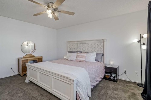 212 Cove Court, Chestermere, AB - Indoor Photo Showing Bedroom