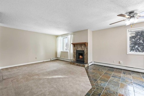 3211-80 Glamis Drive Sw, Calgary, AB - Indoor With Fireplace