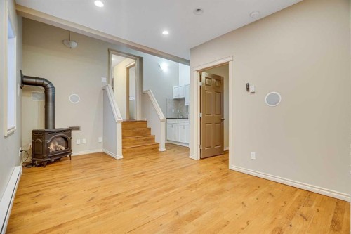 113 Cimarron Grove Close, Okotoks, AB - Indoor Photo Showing Other Room With Fireplace