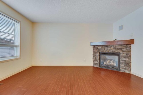 113 Cimarron Grove Close, Okotoks, AB - Indoor Photo Showing Living Room With Fireplace