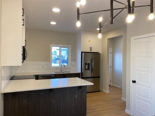 341 Ellen Park, Crossfield, AB - Indoor Photo Showing Kitchen With Upgraded Kitchen