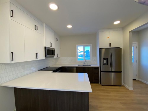 341 Ellen Park, Crossfield, AB - Indoor Photo Showing Kitchen With Stainless Steel Kitchen With Double Sink