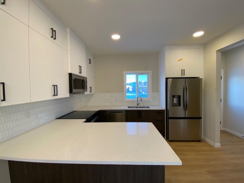 341 Ellen Park, Crossfield, AB - Indoor Photo Showing Kitchen With Stainless Steel Kitchen With Double Sink