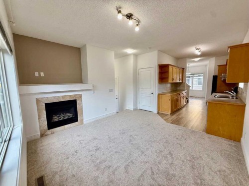 17 Bridleridge Manor Sw, Calgary, AB - Indoor With Fireplace