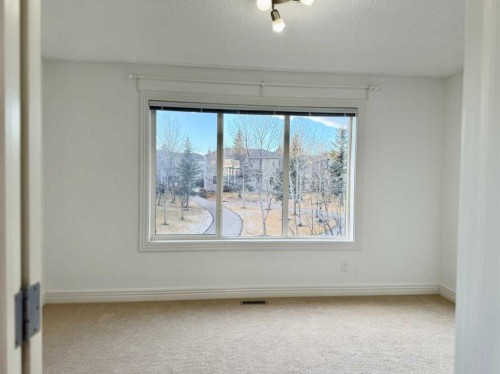 17 Bridleridge Manor Sw, Calgary, AB - Indoor Photo Showing Other Room