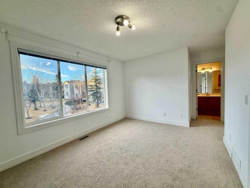 17 Bridleridge Manor Sw, Calgary, AB - Indoor Photo Showing Other Room