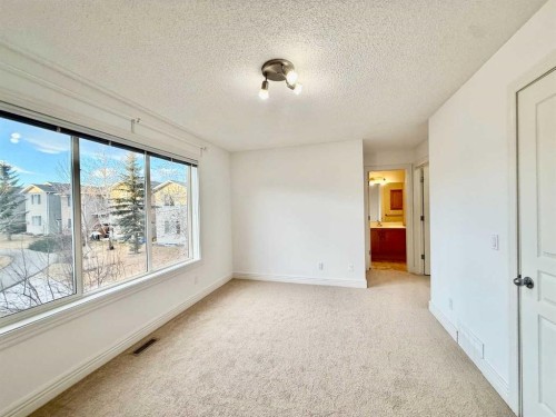 17 Bridleridge Manor Sw, Calgary, AB - Indoor Photo Showing Other Room