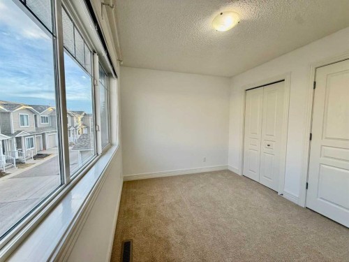 17 Bridleridge Manor Sw, Calgary, AB - Indoor Photo Showing Other Room