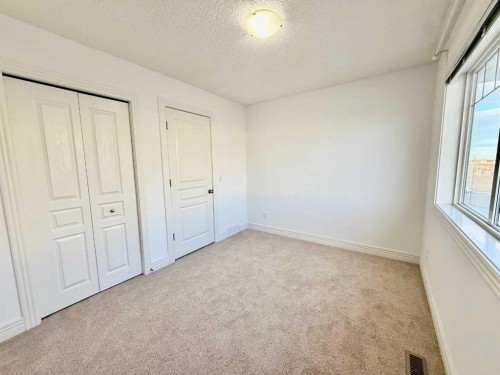 17 Bridleridge Manor Sw, Calgary, AB - Indoor Photo Showing Other Room