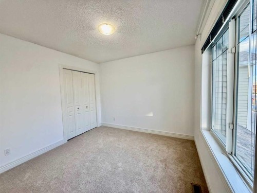 17 Bridleridge Manor Sw, Calgary, AB - Indoor Photo Showing Other Room