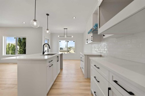 9 Mcclung Gate, Carstairs, AB - Indoor Photo Showing Kitchen With Upgraded Kitchen