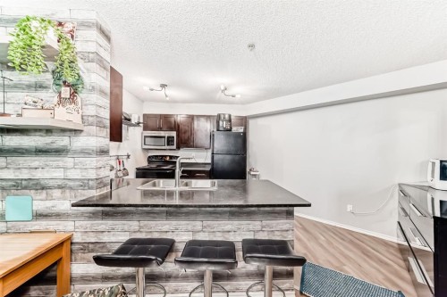 120-355 Taralake Way Ne, Calgary, AB - Indoor Photo Showing Kitchen With Double Sink