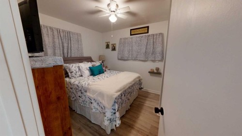 5092 51 Avenue, Stavely, AB - Indoor Photo Showing Bedroom