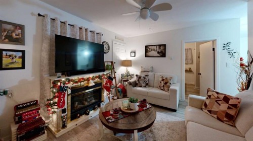 5092 51 Avenue, Stavely, AB - Indoor Photo Showing Living Room With Fireplace