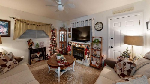 5092 51 Avenue, Stavely, AB - Indoor Photo Showing Living Room With Fireplace