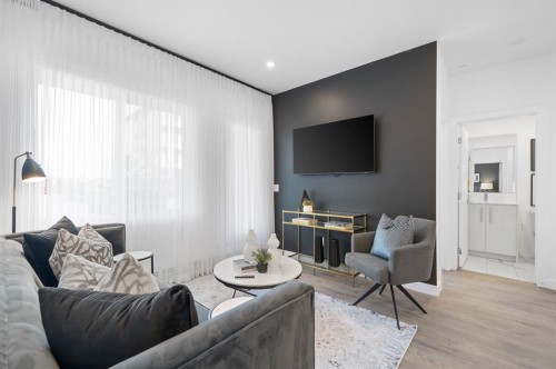 2210-6 Merganser Drive West, Chestermere, AB - Indoor Photo Showing Living Room