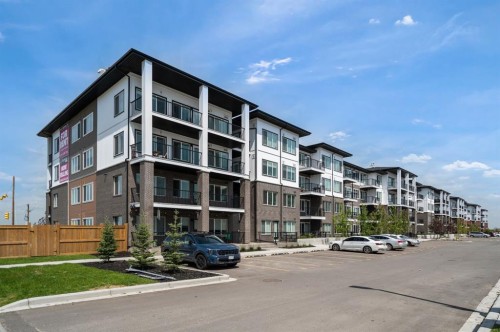 4417-6 Merganser Drive West, Chestermere, AB - Outdoor With Balcony With Facade