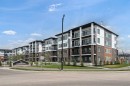 4417-6 Merganser Drive West, Chestermere, AB  - Outdoor With Balcony With Facade 