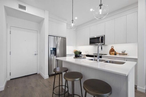 4417-6 Merganser Drive West, Chestermere, AB - Indoor Photo Showing Kitchen With Double Sink With Upgraded Kitchen