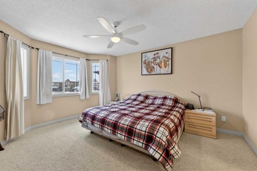 1163 Prairie Springs Hill Sw, Airdrie, AB - Indoor Photo Showing Bedroom
