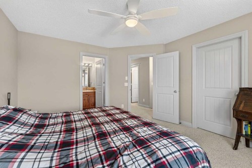 1163 Prairie Springs Hill Sw, Airdrie, AB - Indoor Photo Showing Bedroom