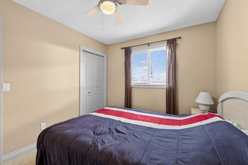 1163 Prairie Springs Hill Sw, Airdrie, AB - Indoor Photo Showing Bedroom