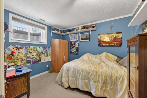 1163 Prairie Springs Hill Sw, Airdrie, AB - Indoor Photo Showing Bedroom