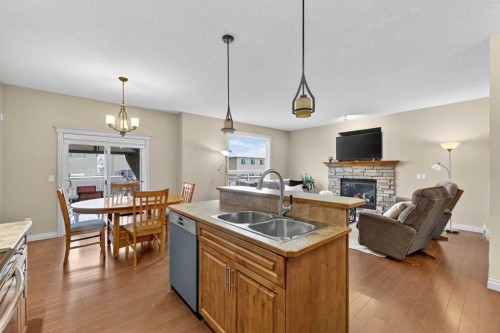 1163 Prairie Springs Hill Sw, Airdrie, AB - Indoor Photo Showing Other Room With Fireplace