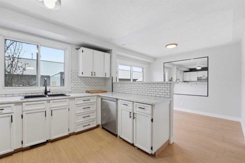 16 Cedarwood Rise Sw, Calgary, AB - Indoor Photo Showing Kitchen With Double Sink