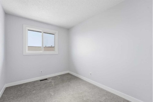 16 Cedarwood Rise Sw, Calgary, AB - Indoor Photo Showing Other Room