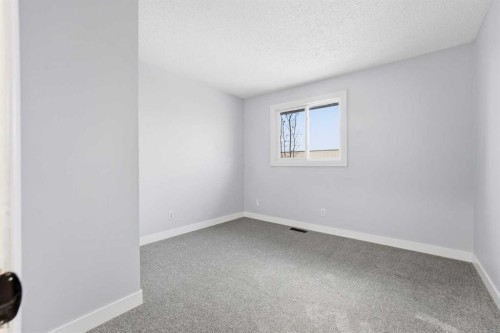 16 Cedarwood Rise Sw, Calgary, AB - Indoor Photo Showing Other Room