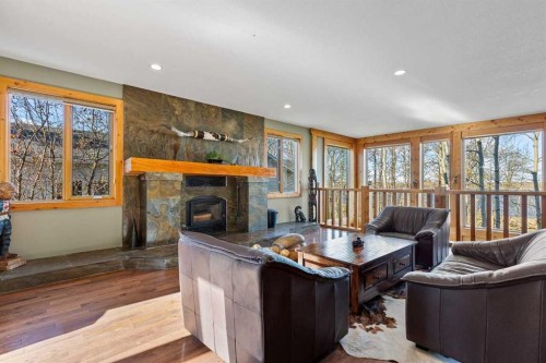 80 Cochrane Lake Trail, Cochrane Lake, AB - Indoor Photo Showing Living Room With Fireplace