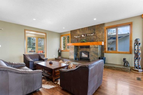 80 Cochrane Lake Trail, Cochrane Lake, AB - Indoor Photo Showing Living Room With Fireplace