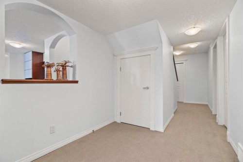 153 Crestridge Way Sw, Calgary, AB - Indoor Photo Showing Other Room