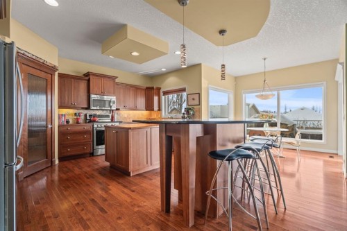 153 Crestridge Way Sw, Calgary, AB - Indoor Photo Showing Kitchen With Upgraded Kitchen