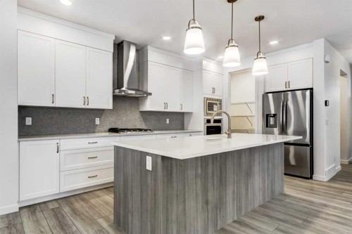 9 Magnolia Path Se, Calgary, AB - Indoor Photo Showing Kitchen With Upgraded Kitchen