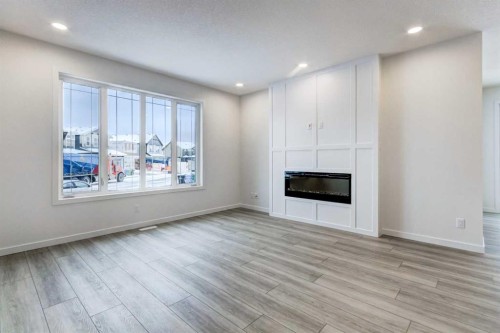 9 Magnolia Path Se, Calgary, AB - Indoor Photo Showing Living Room With Fireplace