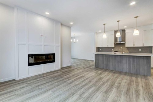 9 Magnolia Path Se, Calgary, AB - Indoor With Fireplace