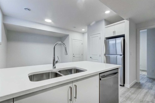 9 Magnolia Path Se, Calgary, AB - Indoor Photo Showing Kitchen With Double Sink