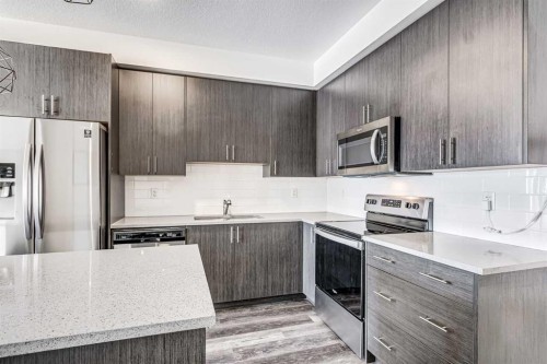 3409-298 Sage Meadows Park Nw, Calgary, AB - Indoor Photo Showing Kitchen With Stainless Steel Kitchen With Double Sink With Upgraded Kitchen