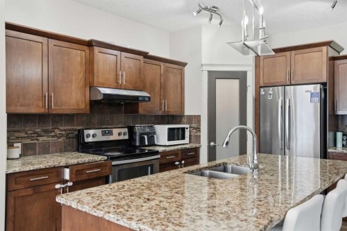 14 Skyview Ranch Street Ne, Calgary, AB - Indoor Photo Showing Kitchen With Stainless Steel Kitchen With Double Sink With Upgraded Kitchen