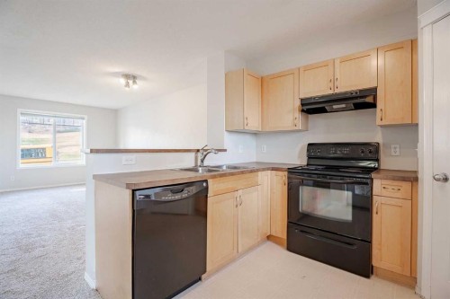 122 Panamount Drive Nw, Calgary, AB - Indoor Photo Showing Kitchen With Double Sink
