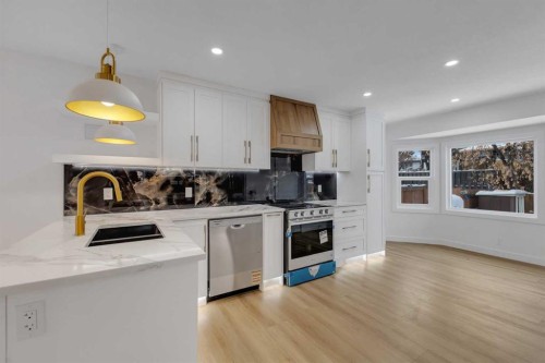 19 Cedargrove Place Sw, Calgary, AB - Indoor Photo Showing Kitchen With Double Sink