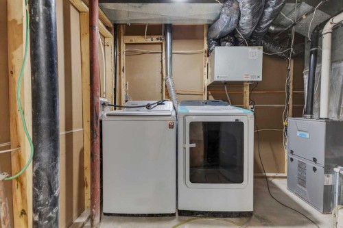 19 Cedargrove Place Sw, Calgary, AB - Indoor Photo Showing Laundry Room