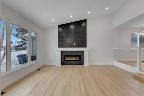 19 Cedargrove Place Sw, Calgary, AB - Indoor Photo Showing Living Room With Fireplace