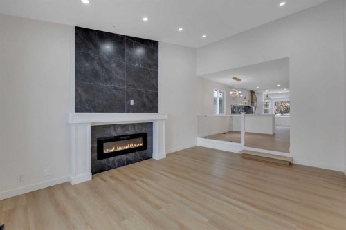 19 Cedargrove Place Sw, Calgary, AB - Indoor Photo Showing Living Room With Fireplace