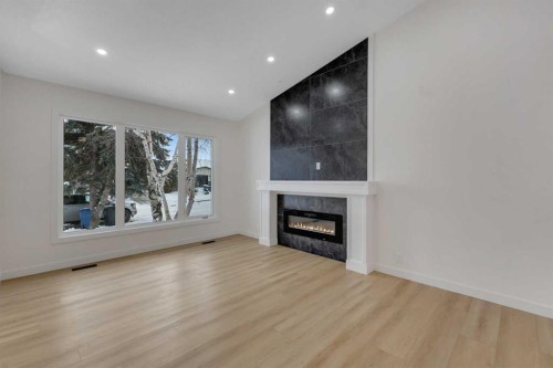 19 Cedargrove Place Sw, Calgary, AB - Indoor Photo Showing Living Room With Fireplace