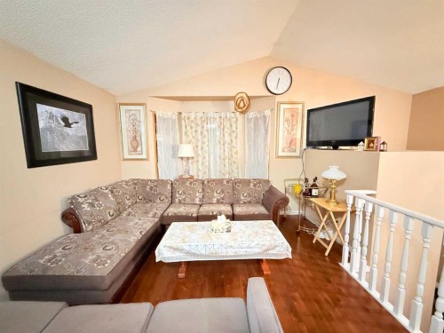 6946 Laguna Way Ne, Calgary, AB - Indoor Photo Showing Living Room